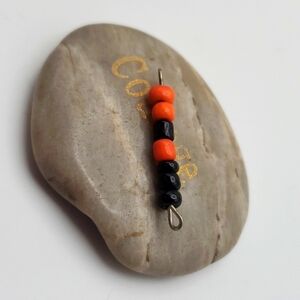 This is Halloween spooky shocking orange and black beaded‎ necklace pendant